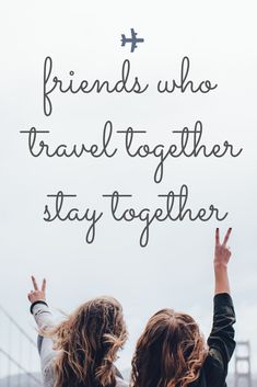 two girls with their arms in the air and text that reads friends who travel together stay together