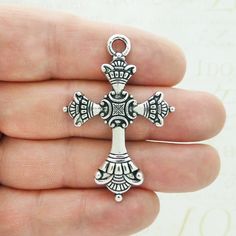 You will receive BULK 9 - Large Ornate Silver Cross Pendant in Pewter! These charms are a quality Silver Pewter for all your jewelry and crafting projects! - (9) Silver Cross Charm - 52x35x3mm ( 25.4mm = 1 inch ) - Quality Pewter - Item # SP1912B All Items will come as shown in a poly bag! WE ARE LOCATED IN TEXAS. WHICH MEANS YOU RECEIVE ITEMS QUICKLY IF IN THE U.S! WE ALSO SHIP INTERNATIONALLY All items are shipped after payment is received for your convenience We order each charm at such large Island Jewelry, Silver Cross Pendant, Gold Cross Pendant, Letter Beads, Poly Bags, Cross Charms, Jewelry Companies, Silver Cross, Star Pendant