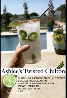 a person holding up a drink with limes on it and the caption above reads, ashee's twisted chillon