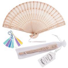 a bamboo hand fan with tags and other items