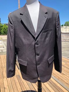 "Vintage light weight wool sport coat. Color is a super dark navy, and looks like a soft black or dark charcoal in some light. It has a very subtle invisible plaid weave, with very faint hints of magenta. The fabric is lightweight and is either 100% wool or a wool and silk blend. Tag size 44 L (long). Georgio Belli, Milano Italy. Hand tailored. Excellent condition; no holes, no stains, no fading, no moth bites. The weave has a shimmer in direct sun, but matte in subdued lighting. Shoulders:betwe Classic Long-sleeved Solid Suits, Fitted Solid Sport Coat With Button Closure, Fitted Solid Sport Coat With Pockets, Fitted Solid Color Sport Coat For Business, Solid Fitted Sport Coat For Business, Fitted Solid Sport Coat For Office, Vintage Sport, Super Dark, Milano Italy