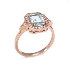 The rose gold Katerina ring is our show-stopping piece and has a large 1.3 ct aquamarine stone in the center. Adorning the stone are 28 sparkling diamonds creating a halo effect around the stone. It’s a ring inspired by royalty and it's absolutely glamorous. **Due to the nature of the natural Aquamarine the color of the center stone may vary** Material: 14K or 18K GoldGemstone: Aquamarine, DiamondsMeasurement: Aqua 8 6mm, 26 diamonds 1.2mm each, 2 diamonds 1.6mm eachAverage total weight: Aqua 1.3CT, Diamond 0.3CTAverage total clarity + colors : VS-F All features can be customized! please contact us if you wish to make changes, we love making custom designs. All of our jewelry is carefully handmade in our atelier *HC diamond are all conflict free diamonds To order by phone click here>> +972 Rose Gold Blue Topaz Ring With Accent Stones, Formal Rose Gold Topaz Ring With Diamond Accents, Aquamarine Diamond Ring With Halo Setting For Formal Events, Formal Rose Gold Ring With Blue Topaz, Formal Rose Gold Blue Topaz Ring, Aquamarine Octagon Wedding Ring, Octagon Aquamarine Wedding Ring, Halo Effect, Letter Bracelet