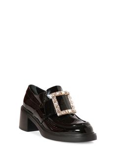 60mm Heel. Patent leather upper. Embellished with metal buckle . Leather lining and insole. Leather sole Denim Pumps, Roger Vivier Shoes, Patent Loafers, Leather Loafers Women, Embellished Shoes, Denim Shoulder Bags, Patent Leather Loafers, Patent Heels, Satin Pumps