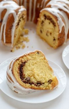 a bundt cake with white icing on a plate