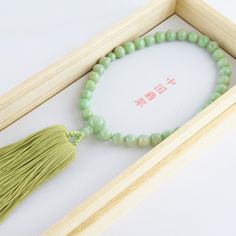 Chinese Jade Stone Buddhist Prayer Beads Characteristics of the product Material : Chinese Jadeite, Silk cord Head bead : about 10mm (0.39in) Main bead : about 8mm (0.31in) Inner circumference : about 25cm (9.84in) Tassel length : about 9cm (3.54in) Handmade in Kyoto, JAPAN About Chinese Jade Chinese jade refers to the jade mined or carved in China from the Neolithic onward. It has long been prized by the Chinese who called it "The heavenly gem", Confucius himself thought it was the representati Elegant Jade Beads As Gift, Adjustable Jade Beaded Necklace With 8mm Beads, Round Jade Beads For Gifts, Jade Beads Gift, Hand-strung Jade Beads For Jewelry Making, Hand-strung Jade Beaded Necklaces With Round Beads, Jade Beads With Large Beads For Gifts, Adjustable Jade Beaded Necklaces With Round Beads, Gift Jade Beads With Large Beads