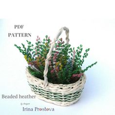 a basket filled with flowers sitting on top of a white table