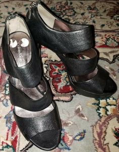 These lovely shoes feature black leather and a back zipper. Peep Toe Heels, Dansko Professional Clog, Mary Jane Sneaker, Clogs, Calvin Klein, Black Leather, Pumps, Zipper, Heels