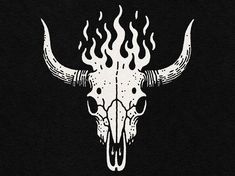 a white bull skull with flames on it's face is shown against a black background