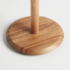 a wooden umbrella stand on a white background