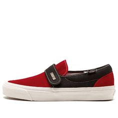 The Vans Slip-On 47 DX is back with a brand new colorway from the Fear of God collection. This limited edition shoe features a black canvas upper with a red suede vamp and heel, making it a must-have for any Vans fan. The upper is detailed with a black velcro strap with Fear of God branding, a padded collar, and white contrast stitching. The co-branded leather insoles, white vulcanized rubber midsole, and honeycomb gum rubber outsole complete the look of this stylish sneaker. (SNKR/Retro/Casual/Velcro/Unisex/Colorblock) Vans Sneakers In University Red For Streetwear, Vans Skate Shoes With Red Sole For Streetwear, Slip-on Skate Shoes With Red Sole For Streetwear, Red Vans Skate Shoes With Red Sole, Red Vans Skate Shoes, Vans Leather Sneakers With Red Sole, Urban Red Skate Shoes For Streetwear, Red Urban Skate Shoes For Streetwear, Urban Red Skate Shoes With Rubber Sole