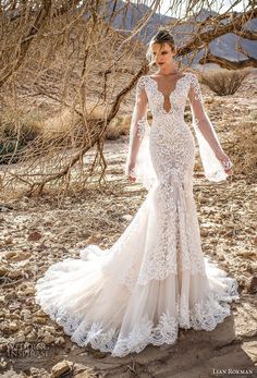 a woman standing in the desert wearing a wedding dress