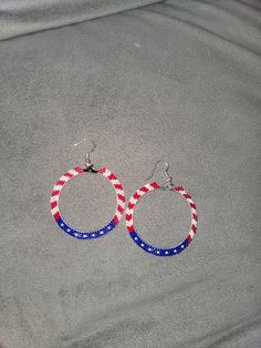 Hand beaded american flag hoop earrings hypoallergenic sterling silver earring hook 2 in. Patriotic Earrings For 4th Of July, Patriotic 4th Of July Earrings, Patriotic Adjustable Dangle Jewelry, Patriotic Beaded Earrings For 4th Of July, Nickel Free Dangle Jewelry For 4th Of July, White Dangle Earrings For 4th Of July, Patriotic American Flag Jewelry For Independence Day, Handmade Patriotic Dangle Beaded Earrings, Handmade Patriotic Drop Earrings