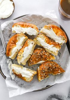 bread with cream cheese and sesame seeds on a plate