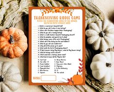 a thanksgiving riddle game with pumpkins and other decorations