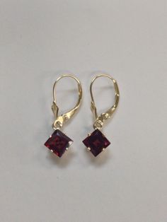 Solid 14kt Yellow Gold Dangle Earrings Natural Garnet is  6x6 mm Square Each Natural Garnet is 2.50 Tcw  Earring Length is 1" inch WITH GIFT BOX ESTIMATED RETAIL VALUE: $320 Gold Dangle Earrings, Garnet Earrings, Jewelry Lookbook, Square Cut, Gold Earrings Dangle, Fine Jewellery Earrings, Elegant Jewelry, Garnet, 1 Inch