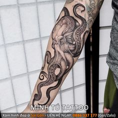 an octopus tattoo on the left arm