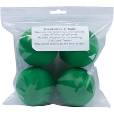 four green plastic balls in a bag with a label on it that says decorative 3 ball