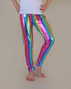 Glitzy, shimmery, metallic pants, while lightweight fabric little ones comfy. These glam pants are fun, fashionable and your little lady will love wearing it with their perfect amount of pizazz and shine. Pant inseam:3: 16"4: 17"5: 18"6: 19"7: 21"8: 22"10: 23"12: 24"14: 25"100% polyester We recommend hand washing and hang drying this article of clothing to keep the metallic shine from fading Multicolor Sequined Bottoms For Party Season, Shiny Metallic Leggings For Party, Metallic Shiny Leggings For Party, Pink Stretch Leggings For Party, Stretch Multicolor Party Pants, Multicolor Stretch Pants For Party, Stretch Multicolor Pants For Party, Iridescent Disco Bottoms For Party, Stretch Party Leggings