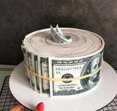 a cake made to look like a roll of money