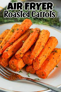 air fryer roasted carrots on a white plate with a fork and parsley