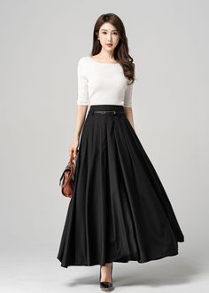 "This black pleated maxi skirt is the perfect combination of comfort and style. The elegant and flowy design is made with high-quality materials that drape beautifully on any figure. The versatile style and classic color make it easy to dress up or down, so you can wear it for any occasion. The pleated design adds a touch of femininity and movement to your look, making it perfect for choosing. DETAIL * 100% polyester * Pleated skirt * Ankle Length * Two pockets * Belt loops on waistband * Side z Maxi Skirt Formal Outfit, Black Maxi Skirt For Work, Pleated Full Maxi Skirt, Formal Pleated Maxi Skirt, Solid Color Long Skirt With Pleated Waist, Long Skirt With Pleated Waist In Solid Color, Solid Pleated Maxi Length Skirt, Black Pleated Waist Maxi Skirt For Work, Black Fitted Maxi Skirt With Pleated Waist