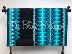 a blue and black blanket with the words, the bling boutiquey on it