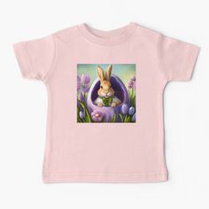 a baby t - shirt with an image of a bunny in the grass and flowers