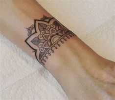 a woman's foot with a tattoo on it