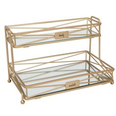 two tiered glass trays with labels on the front and bottom, one is gold