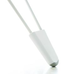 two white toothbrushes in a holder on a white surface