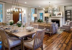 the dining room table is set with place settings for eight people, and there's also a fireplace in the background