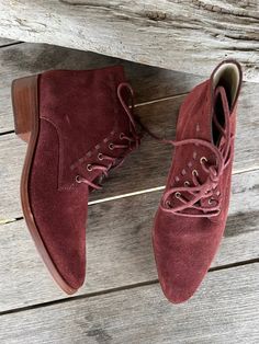 Wine red suede lace up booties with a western feel. little lace through leather detail and leather stacked heel. Leather lining. Leather outsole Size 7 Ankle-high Lace-up Boots With Suede Lining For Fall, Fall Lace-up Boots With Stacked Heel, Fall Suede Lace-up Boots With Suede Lining, Western Lace-up Boots With Snip Toe For Fall, Suede Lace-up Boots With Stacked Heel, Fall Lace-up Boots With Suede Lining, Burgundy Lace-up Boots For Fall, Burgundy Lace-up Boots With Round Toe For Fall, Burgundy Almond Toe Boots For Fall