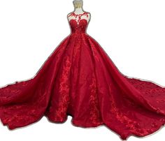 a red ball gown with white lace on the bottom and neckline, in front of a mannequin