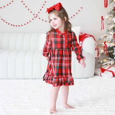 Get ready for holly jolly nights all holiday season in our cozy plaid long sleeve nightgown! This festive nightgown is as soft as a snowflake and as warm as a cup of cocoa by the fire, making it the perfect bedtime outfit for those chilly Christmas nights. The classic red and green plaid pattern brings all the jingle bell joy, making your little one feel like they're wrapped up in a Christmas present. With its girly ruffle trim along the bottom of the gown and around the sleeves, this nightgown is just what your little elf needs to stay snug all night long. Whether they're dreaming of sugarplums or waiting for Santa, this nightgown will keep them comfy and merry all season long! Nightgown Details: 95% Polyester | 5% Spandex Breathable fabric, ideal for sensitive skin True-to-size Includes: Long Sleeve Nightgown, Bedtime Outfit, Personalized Swaddle, Girls Nightgown, Newborn Accessories, Long Nightgown, Personalized Sweater, Sibling Shirts, Cozy Season