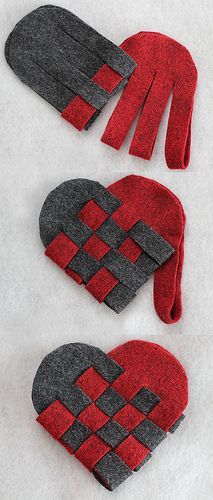 three pairs of mittens and gloves made out of felt on white fabric with red squares