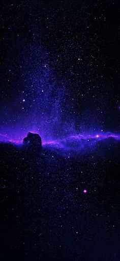 the night sky is filled with purple and blue stars