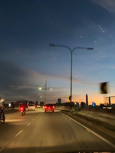 cars driving down the highway at night time