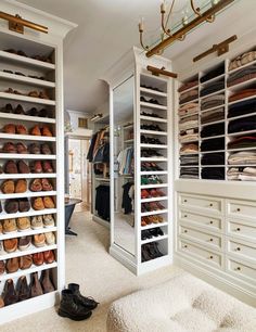 a walk in closet filled with lots of shoes