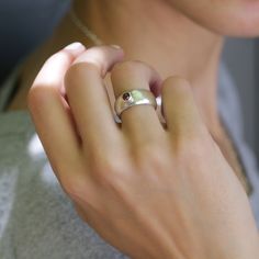 "A simple yet stylish statement jewelry ring bringing Garnet as an accent. This handcrafted Garnet Sterling silver ring will be a pretty piece to accessorize both casual and formal looks. A custom ring you can add to your everyday staples or wrap as a lovely gift for someone dear to your heart. Product Details: ---------------------------------------------------------------- *Ring Size: Please select from the drop-down menu. *Ring width: 0.284\"/ 8.5mm *Stone Diameter: 1.57\"/4mm 💕For matching Rings Ladies, Rings Birthstone, Ladies Rings, Sterling Silver Garnet Ring, Birthstone Rings, Birthday Ring, Custom Ring, Handmade Rings, Crystal Necklace Pendant