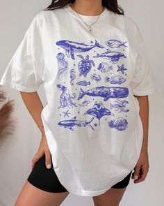 Marine biology, sea animal beachy t shirt. HOW TO ORDER ➀ Select color  ➁ Select the size (Please check the measurement guide)    ✧ Size up 1-2 sizes for a baggy or oversized fit. ➂ Add to cart ✦ The model is wearing size L for an oversized look. DETAILS ✦ 100% Heavy Cotton Tee (Other styles available upon request) ✦ Crew neckline ✦ Direct-to-garment printing - no vinyl, decal, or iron-on technique ✦ Our designs are printed on the garment to last a long time and may not appear as 'glossy' or sat Casual Blue Tops With Fish Print, Casual White Fish Print Top, Summer Fish Print Crew Neck Tops, Summer Crew Neck Top With Fish Print, White Fish Print Shirt For Summer, White Casual Shirt With Fish Print, White Cotton Shirt With Fish Print, Short Sleeve Graphic Tee With Fish Print, Blue Fish Print Top For Summer