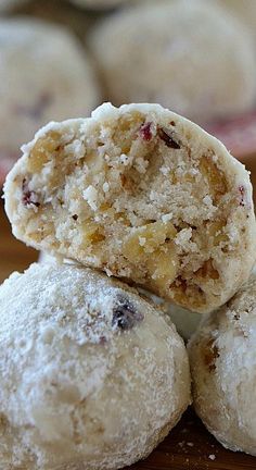 several pastries stacked on top of each other with powdered sugar and crumbs