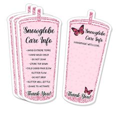 two pink luggage tags with the words, snowgloe care info and thank you