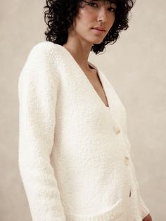 Wrap yourself in the ultimate comfort with our Boucle Cardigan. Boucle yarn has a nubby textured appearance and is our warmest stitch. V-neck. Long sleeves. Button front closure. Front pockets. Ribbed neck, arm cuffs and hem. Straight hem. Made exclusively for Banana Republic Factory. #514724 Arm Cuffs, Boucle Yarn, Arm Cuff, Banana Republic Factory, Banana Republic, Sweaters & Cardigans, Cardigans, Long Sleeves, Yarn