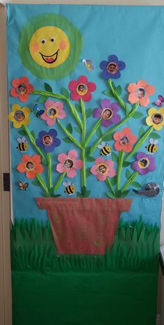 a door decorated with flowers and a smiley face