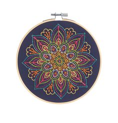 an embroidery kit with a flower design on it