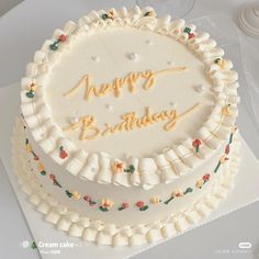 a birthday cake with the words happy birthday written in frosting on it's side