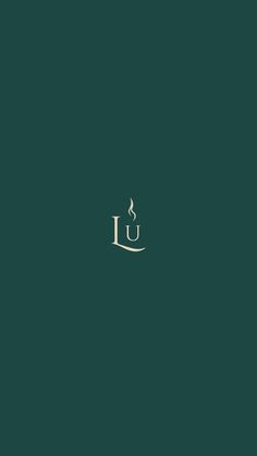 the letter u in gold on a dark green background with an elegant monogramic design