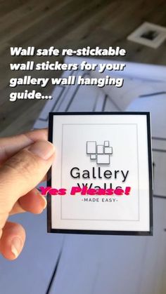 a person holding up a sticker with the words gallery on it and made easy