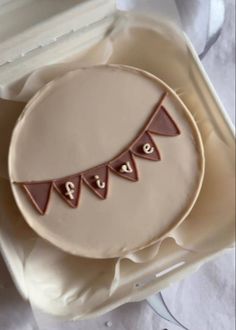 a decorated cake in the shape of a pennant