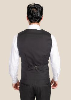 Indulge in the bold and timeless elegance of our Black Pinstripe Vest. cut from Super 120s pure merino wool, this custom-made piece exudes sophistication and sharpness. Elevate your look with a touch of luxury and a classic statement. Elegant Striped Suits For Business Casual, Elegant Fitted Suit With Vertical Stripes, Elegant Tailored Suits With Vertical Stripes, Elegant Striped Fitted Suit, Elegant Fitted Striped Suits, Elegant Suits With Vertical Stripes For Formal Occasions, Elegant Formal Suits With Vertical Stripes, Elegant Business Suits With Vertical Stripes, Classic Fitted Striped Suits